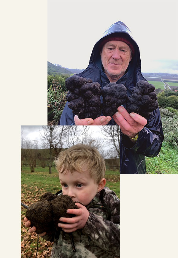 Man and boy holding truffles